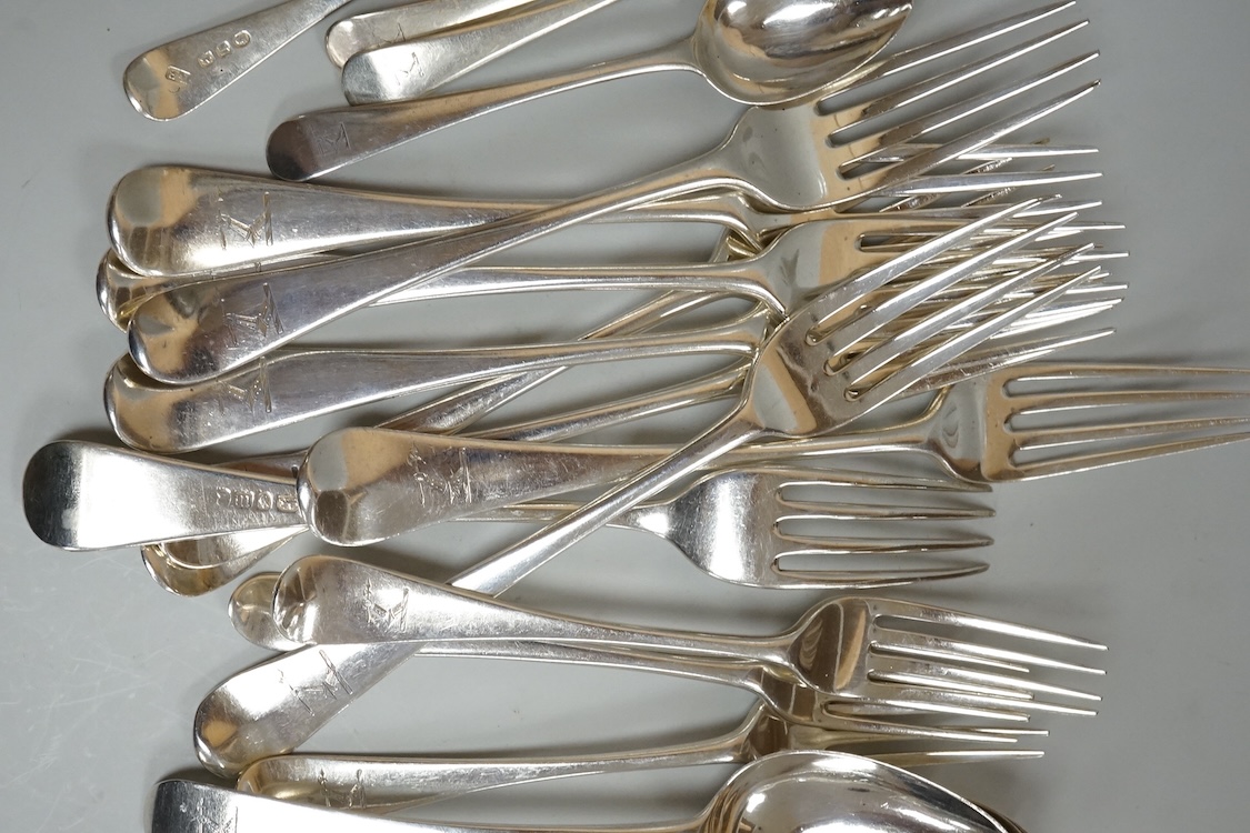 A harlequin part canteen of 19th century Old English pattern flatware, comprising thirty items, all with engraved crest, various dates and makers, 38.1oz.